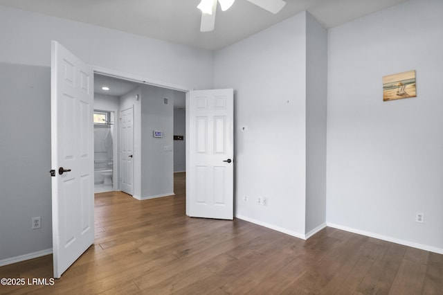 22 Purry Cir, Bluffton, SC 29909 - unfurnished bedroom featuring wood finished floors, connected bathroom, and a ceiling fan