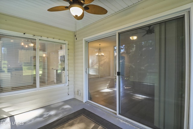 22 Purry Cir, Bluffton, SC 29909 - unfurnished sunroom featuring a ceiling fan and a chandelier