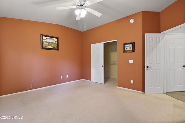 22 Purry Cir, Bluffton, SC 29909 - unfurnished bedroom featuring light carpet, vaulted ceiling, a ceiling fan, and a closet