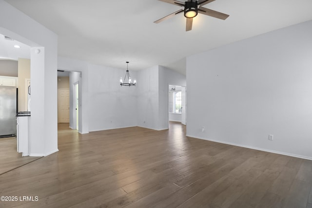 22 Purry Cir, Bluffton, SC 29909 - unfurnished living room featuring a chandelier, a ceiling fan, wood finished floors, and recessed lighting