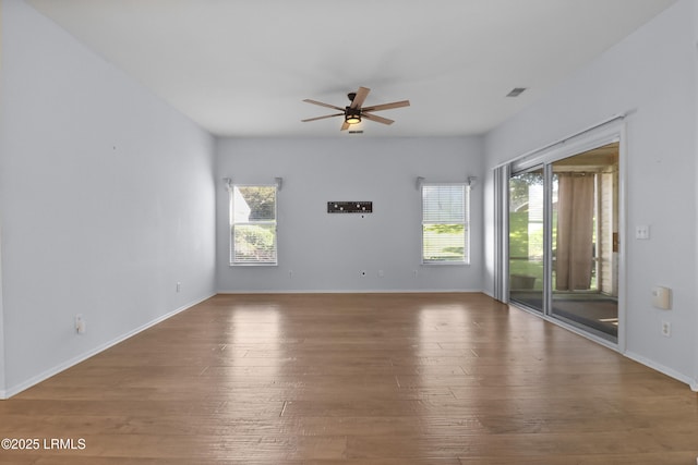 22 Purry Cir, Bluffton, SC 29909 - empty room featuring a ceiling fan, healthy amount of natural light, and wood finished floors