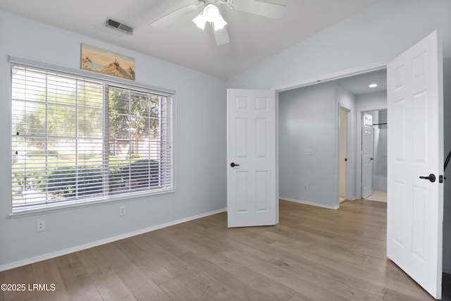 22 Purry Cir, Bluffton, SC 29909 - unfurnished bedroom with light wood finished floors, ceiling fan, and lofted ceiling