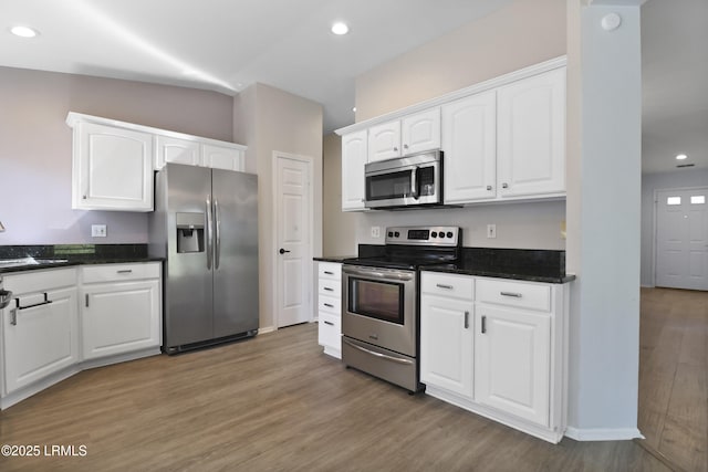 22 Purry Cir, Bluffton, SC 29909 - kitchen featuring stainless steel appliances, white cabinetry, light wood-style floors, and recessed lighting