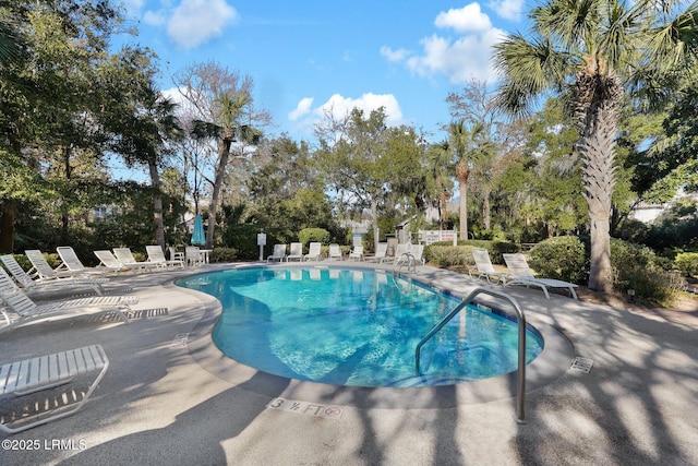 view of swimming pool featuring a patio area