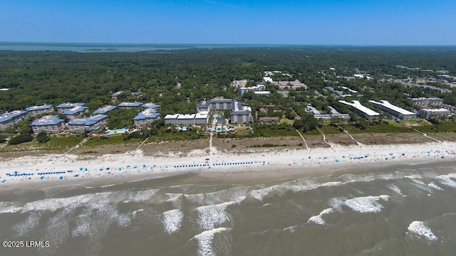 drone / aerial view with a water view and a beach view