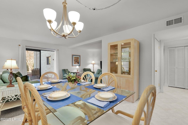 dining area with a chandelier