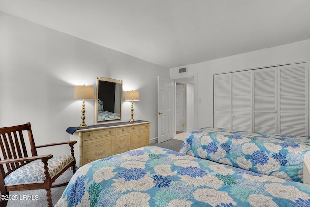 carpeted bedroom with a closet