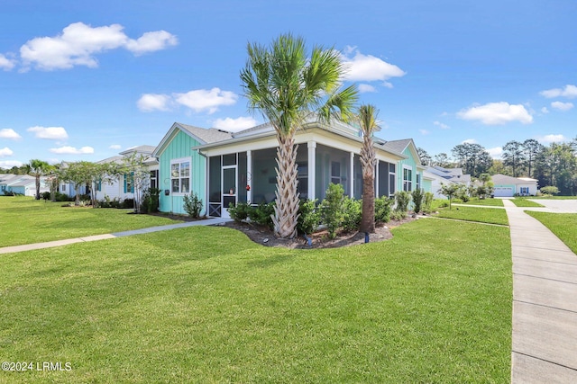 view of front facade featuring a sunroom and a front yard