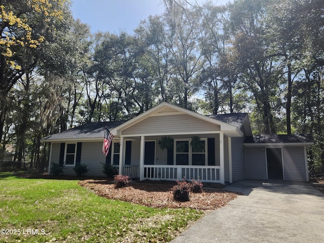 single story home featuring covered porch, driveway, and a front lawn