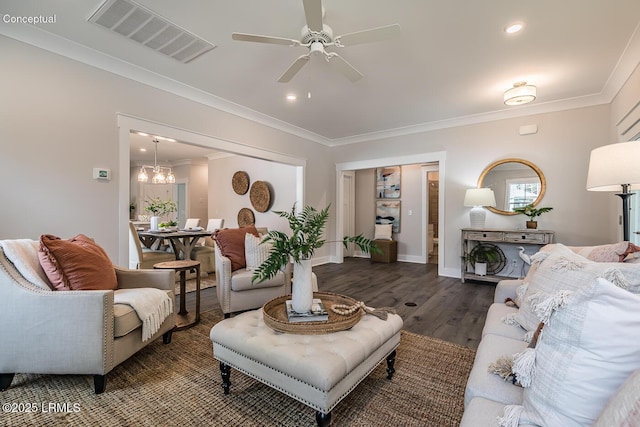 32 Faculty Dr, Beaufort, SC 29907 - living room featuring ceiling fan with notable chandelier, dark wood-type flooring, and ornamental molding