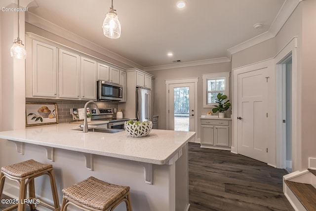 32 Faculty Dr, Beaufort, SC 29907 - kitchen featuring stainless steel appliances, a kitchen bar, kitchen peninsula, and hanging light fixtures