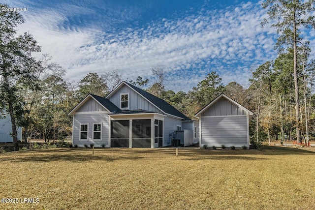 32 Faculty Dr, Beaufort, SC 29907 - rear view of house featuring a sunroom and a lawn
