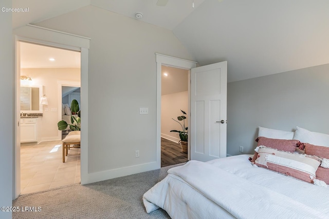 32 Faculty Dr, Beaufort, SC 29907 - carpeted bedroom with lofted ceiling and connected bathroom