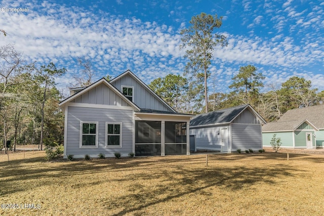 32 Faculty Dr, Beaufort, SC 29907 - back of house with a sunroom and a lawn