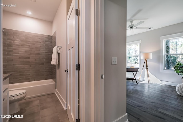 32 Faculty Dr, Beaufort, SC 29907 - full bathroom featuring a healthy amount of sunlight, vanity, toilet, and ceiling fan