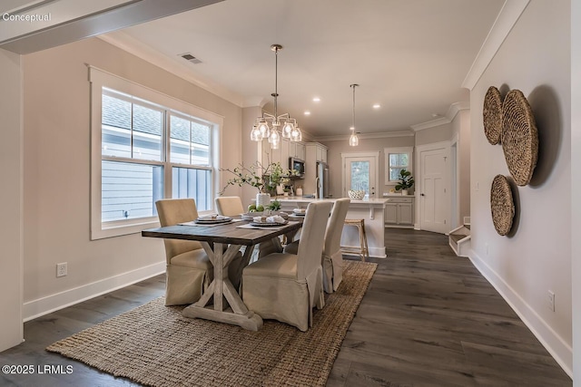 32 Faculty Dr, Beaufort, SC 29907 - dining room featuring crown molding, dark hardwood / wood-style flooring, and an inviting chandelier