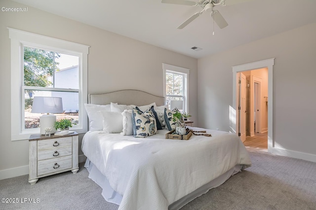 32 Faculty Dr, Beaufort, SC 29907 - carpeted bedroom featuring ceiling fan and multiple windows