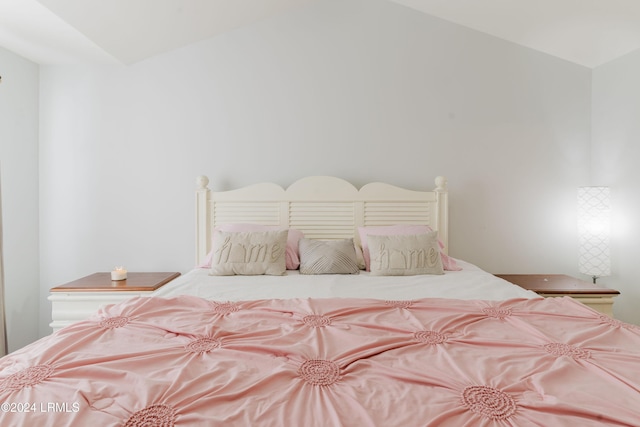 bedroom featuring lofted ceiling