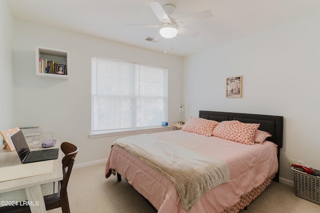 bedroom featuring light colored carpet and ceiling fan