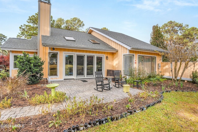 back of property with a patio area