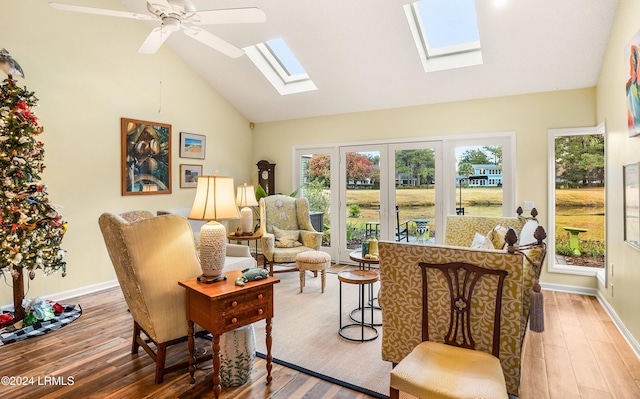 sunroom with ceiling fan and lofted ceiling