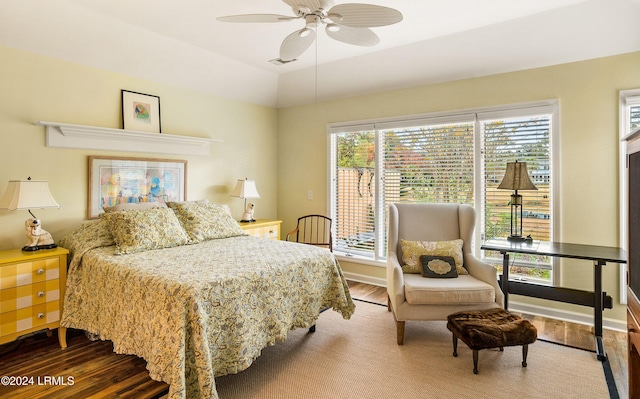 bedroom featuring hardwood / wood-style flooring, ceiling fan, and lofted ceiling