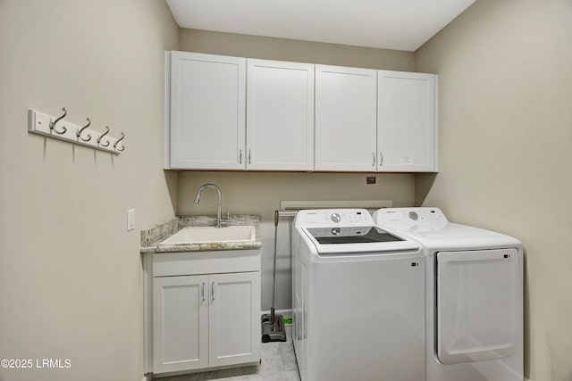 laundry room featuring sink, cabinets, and independent washer and dryer