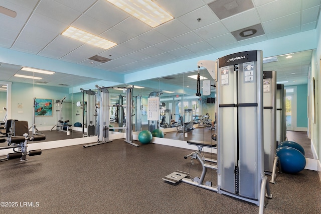 workout area with a drop ceiling