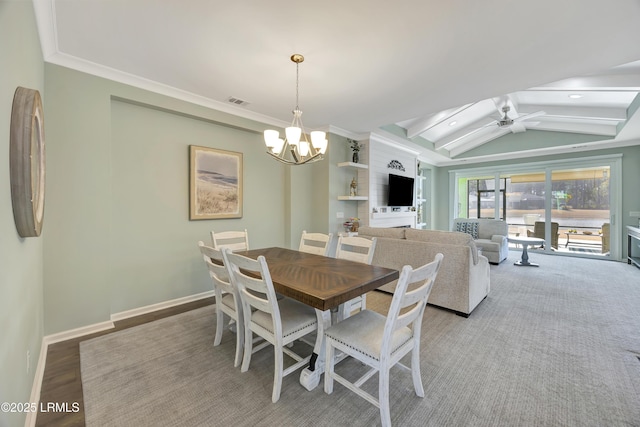 dining area featuring lofted ceiling with beams, ceiling fan with notable chandelier, and light hardwood / wood-style floors