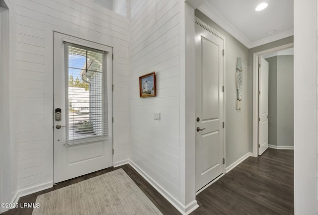 entryway featuring ornamental molding and dark wood-type flooring