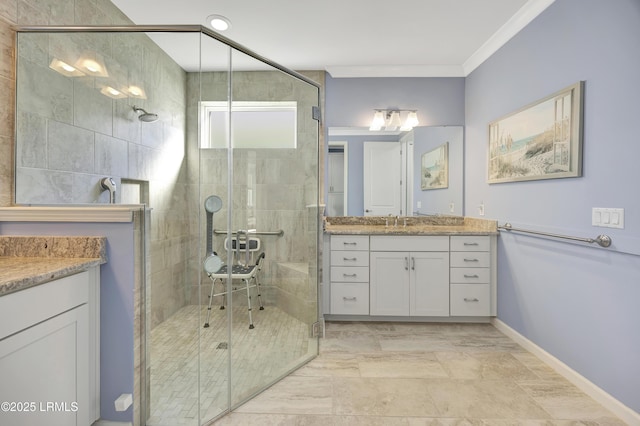 bathroom with ornamental molding, vanity, and a shower with shower door