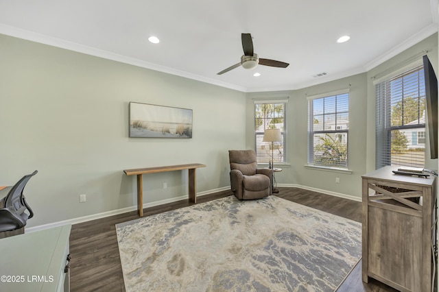 sitting room featuring ceiling fan, ornamental molding, and dark hardwood / wood-style flooring