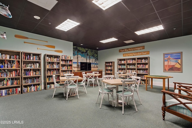 rec room featuring carpet and a drop ceiling