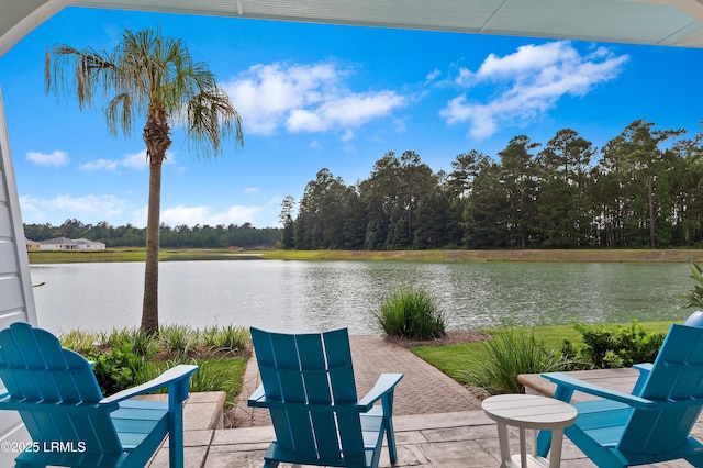 view of patio with a water view