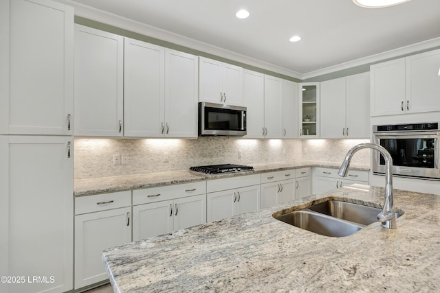 kitchen featuring white cabinetry, sink, and stainless steel appliances