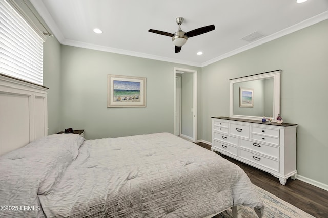 bedroom featuring ceiling fan, ornamental molding, and dark hardwood / wood-style flooring