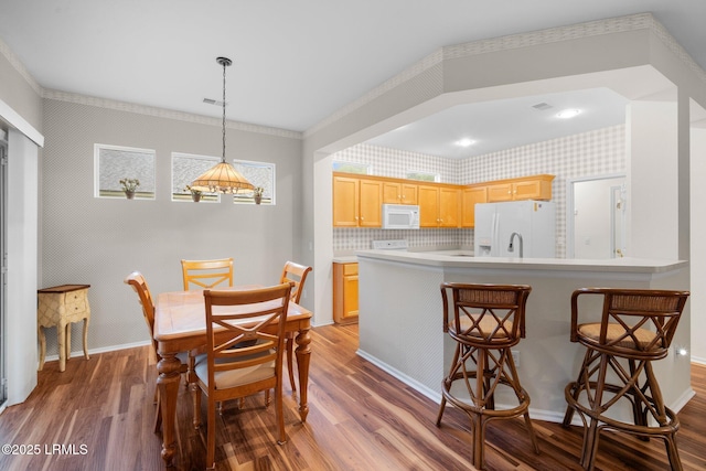 355 Hampton Pl, Bluffton, SC 29909 - dining room featuring wood finished floors, baseboards, and wallpapered walls