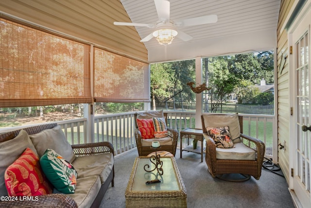 sunroom / solarium featuring ceiling fan