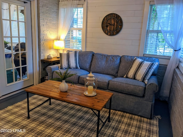 living area featuring wooden walls