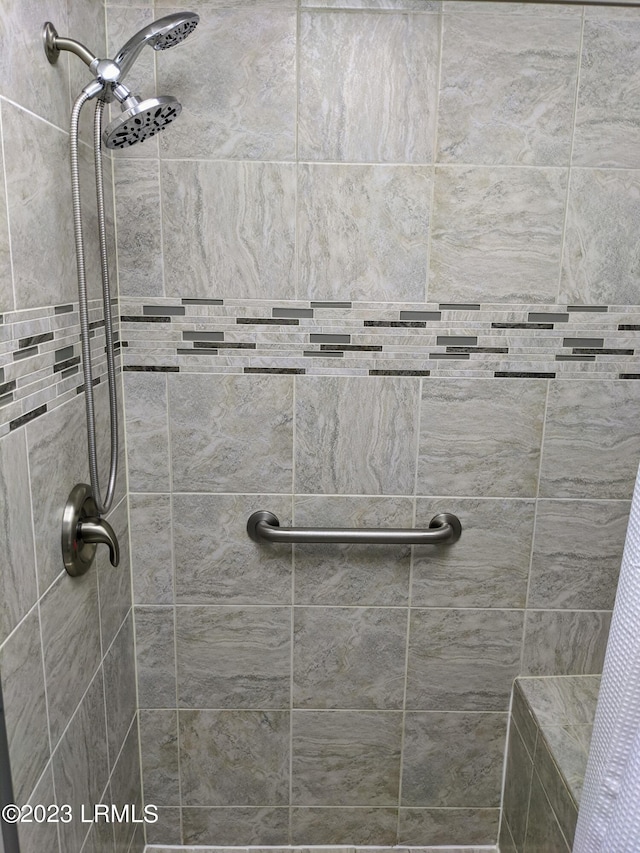 bathroom with a tile shower