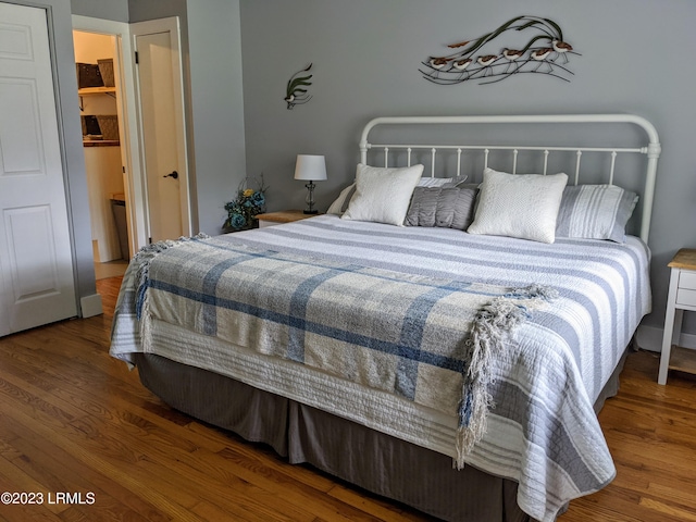 bedroom featuring wood finished floors