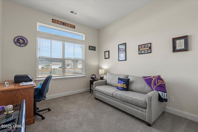 carpeted office with visible vents and baseboards