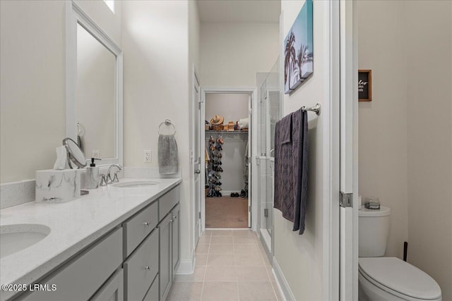 bathroom with tile patterned floors, vanity, and toilet