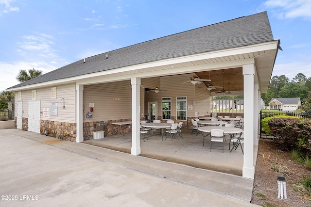 view of patio / terrace with fence, a ceiling fan, and outdoor dining space