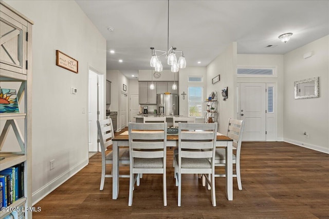 dining room with dark wood-style floors, recessed lighting, and baseboards