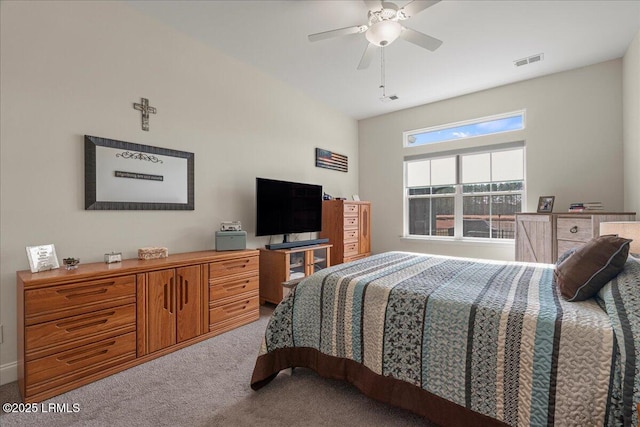 bedroom featuring ceiling fan and carpet