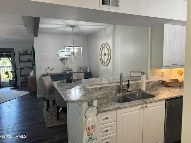 80 Paddle Boat Ln Unit 806, Hilton Head Island, SC 29928 - kitchen featuring dishwasher, a peninsula, dark wood finished floors, white cabinetry, and light stone countertops