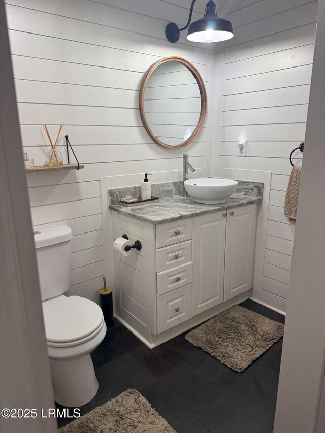 80 Paddle Boat Ln Unit 806, Hilton Head Island, SC 29928 - bathroom featuring vanity, wood walls, and tile patterned floors