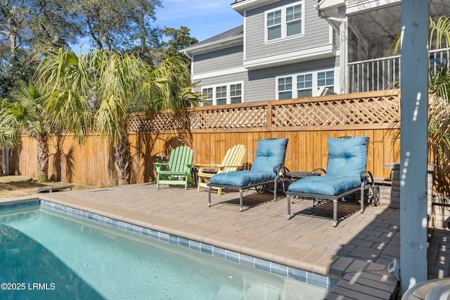 exterior space with a patio area, a fenced backyard, and a fenced in pool