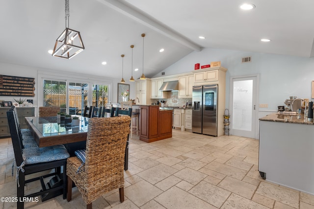 dining room featuring visible vents, lofted ceiling with beams, stone tile flooring, and recessed lighting